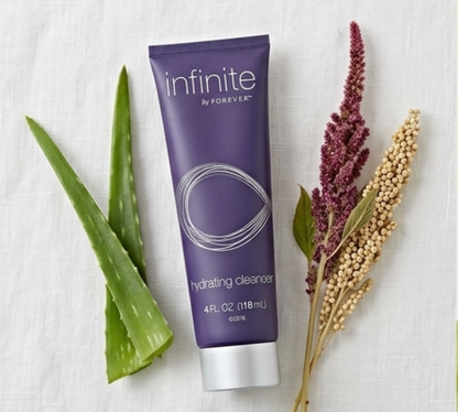 Model applying the aloe-based cleanser in circular motions.